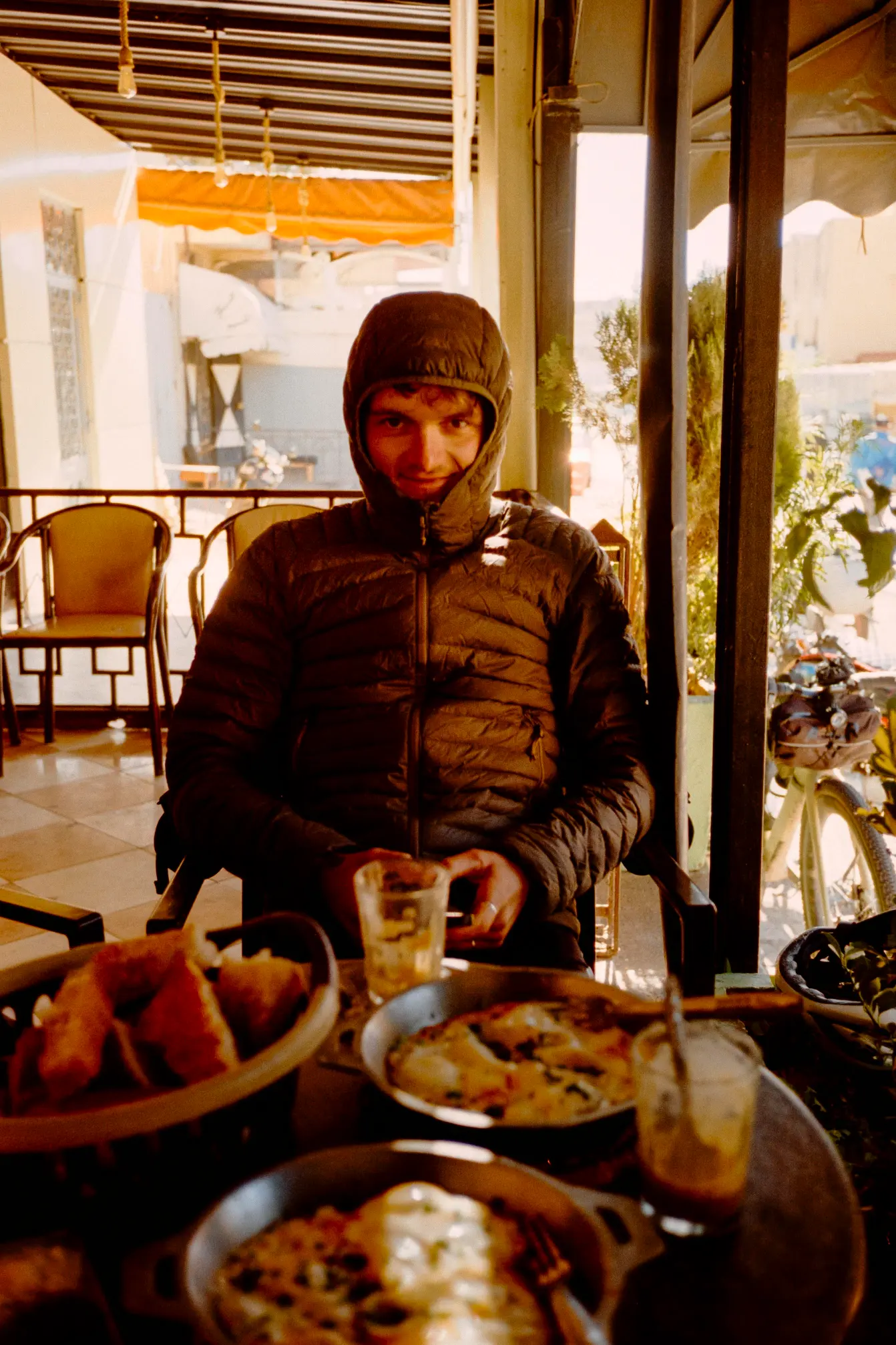 Jan in a Berber cafe in Ouarzazate, cold in the shade
