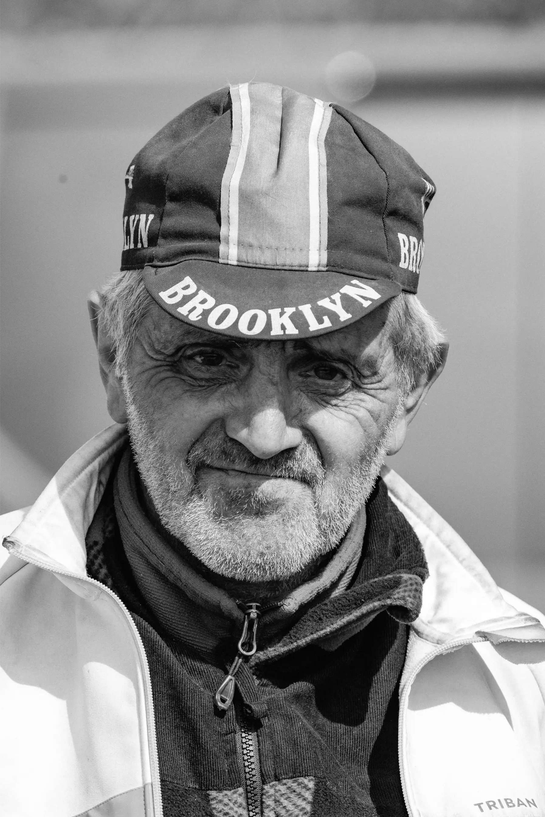 Portrait of the collector with his archive of historic newspapers